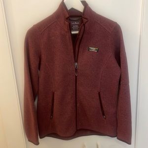 Burgundy polyester sweater.